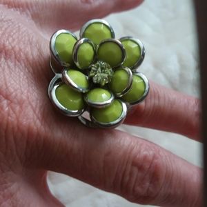 SOLD Flower ring with light green gemstone centered